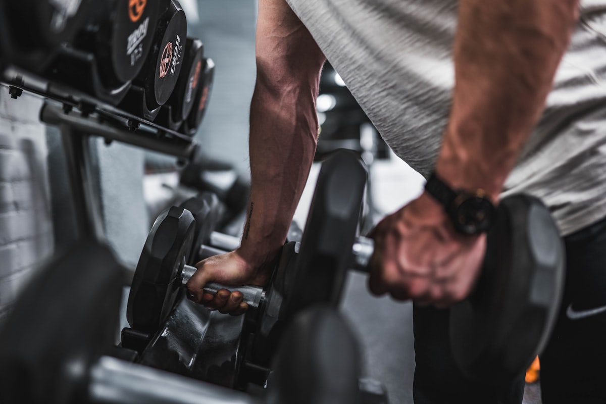 Man measuring protein intake for fitness goals